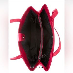 Maroon-red Kate Spade New York dual strap handbag.